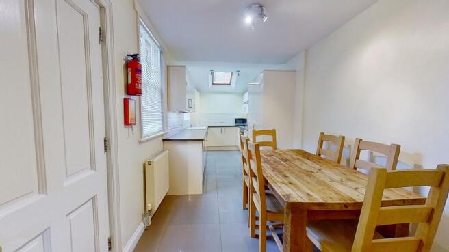 Bright combined kitchen and dining area with a ...