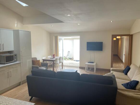 Bright and spacious living area featuring moder...