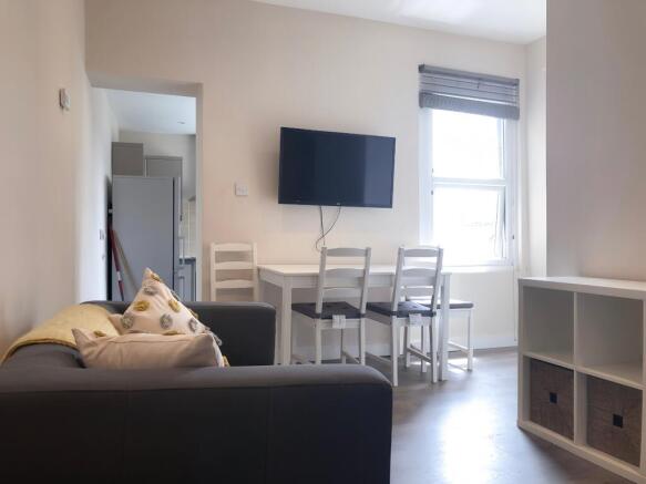 A modern and inviting living room featuring com...