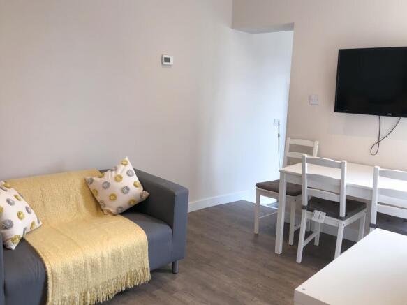 A cozy and inviting living room featuring a com...