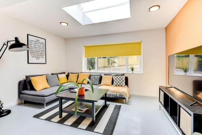 Bright and inviting living room featuring a coz...