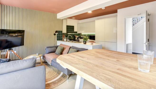 This stylish living room features a modern desi...