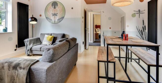 This contemporary living room features stylish ...