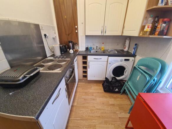 Compact and functional kitchen featuring essent...