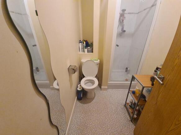 A compact and clean bathroom featuring a modern...