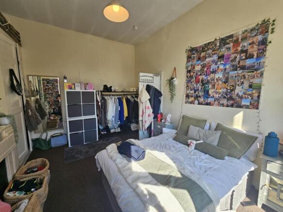 Bright and inviting master bedroom featuring a ...