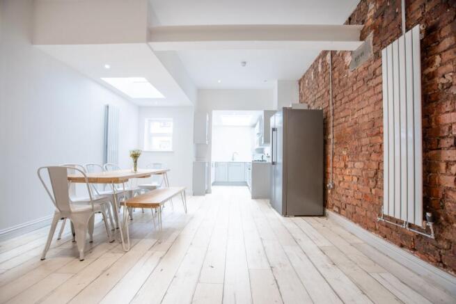 Bright, modern open-plan kitchen and dining are...