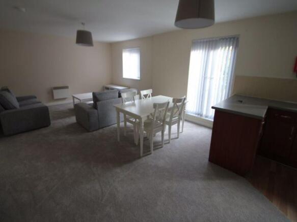 Spacious open-plan living and dining area with ...