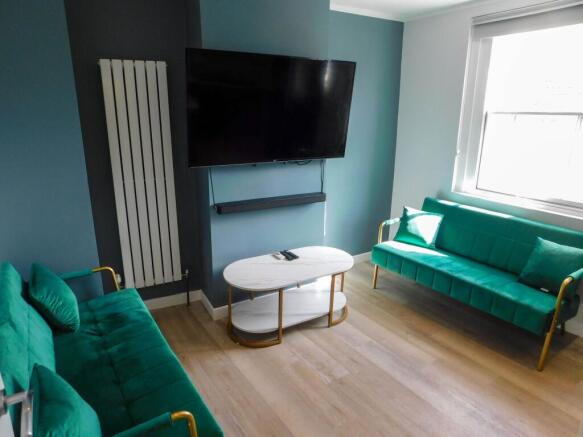 Contemporary living room featuring two vibrant ...