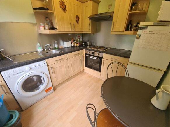 Well-equipped kitchen with fitted cabinets, int...