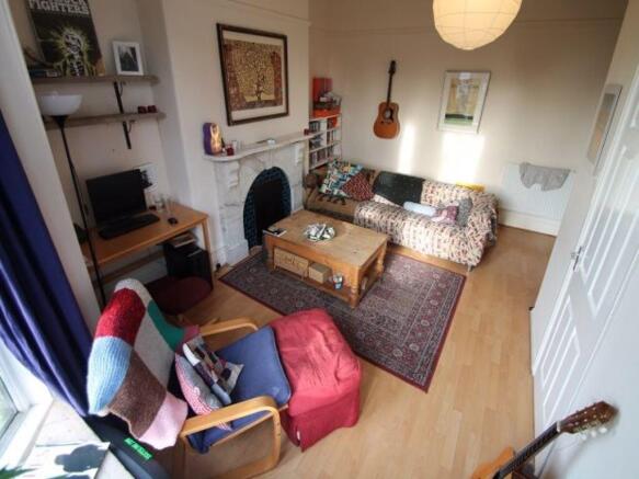 Bright, well-decorated living room with a comfo...