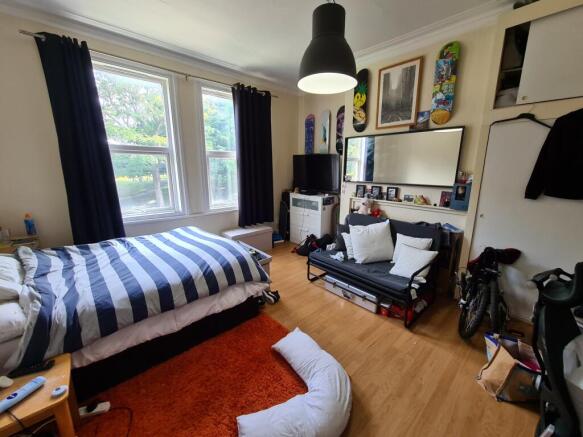 Bright, well-lit double bedroom with large wind...