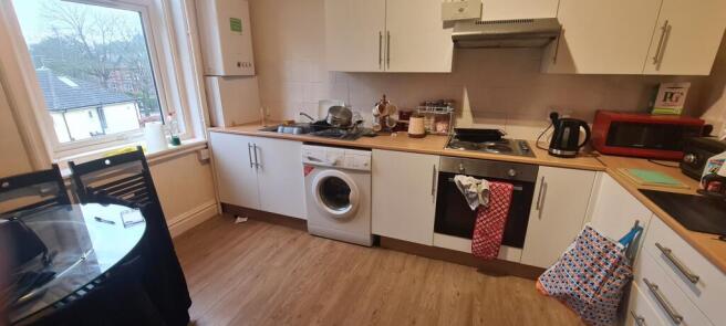 Bright galley-style kitchen with plenty of coun...