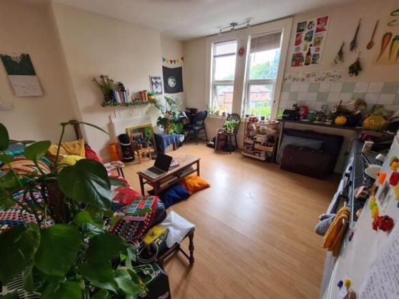 Bright, well-decorated communal living space wi...