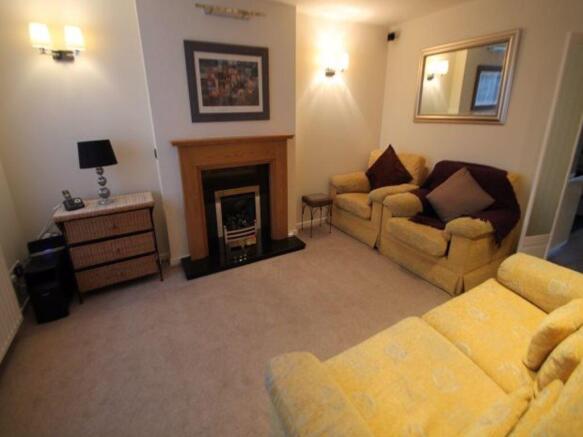 Bright, well-kept living room with cosy seating...