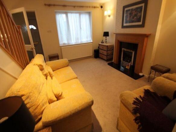 Warm, well-presented living room with comfortab...