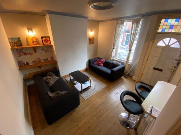 Bright, well-kept living room with two comforta...