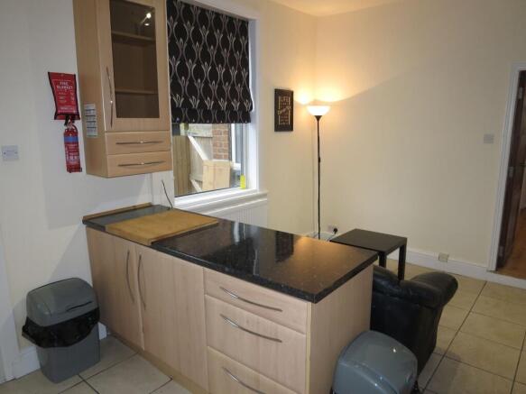 Bright and clean kitchen with ample workspace, ...