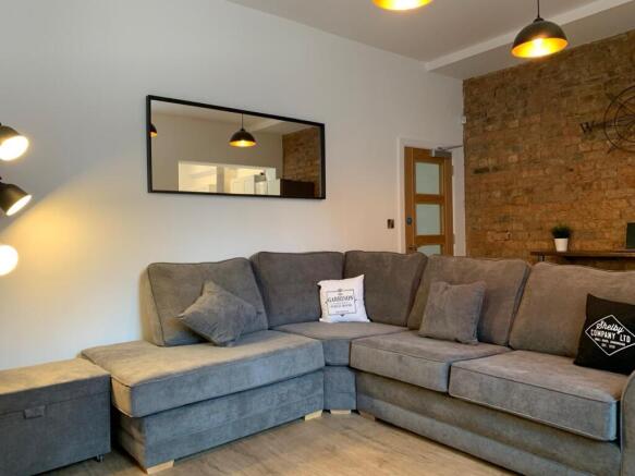 Modern and stylish living room featuring a larg...