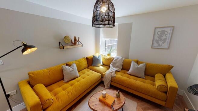 Bright and stylish living room featuring a vibr...
