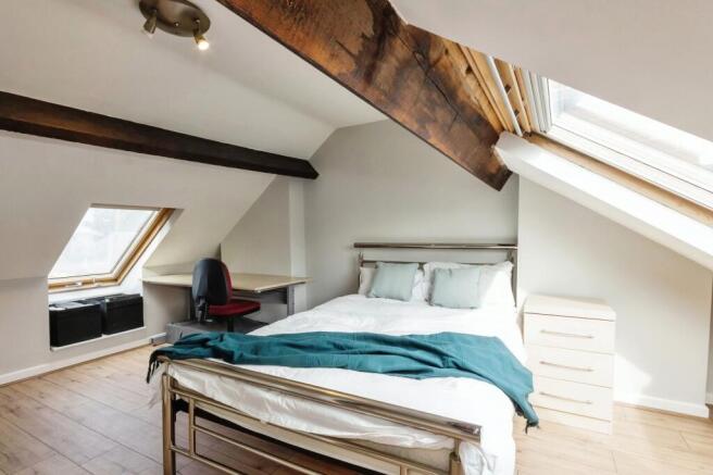 Bright and inviting double bedroom with a moder...