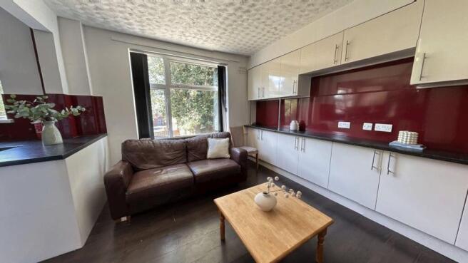 A bright and inviting living room featuring a c...