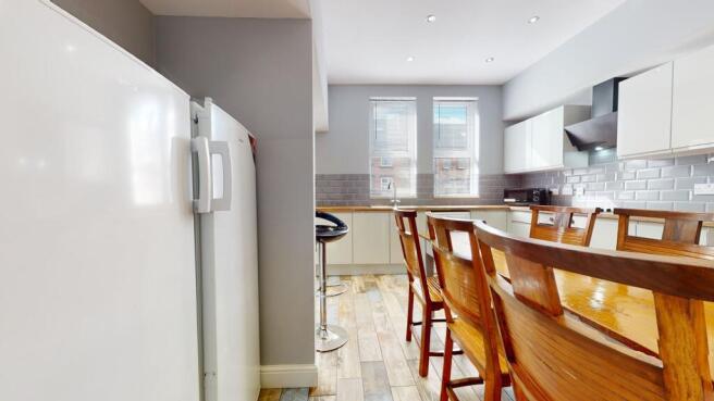 Bright and modern kitchen with ample natural li...