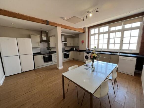 Bright and modern kitchen with ample natural li...