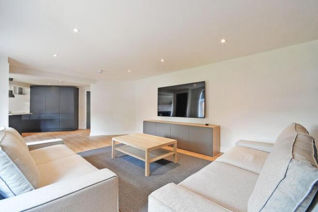 Bright and welcoming living room featuring comf...