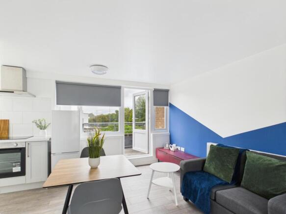 Bright, modern open-plan living area with a com...