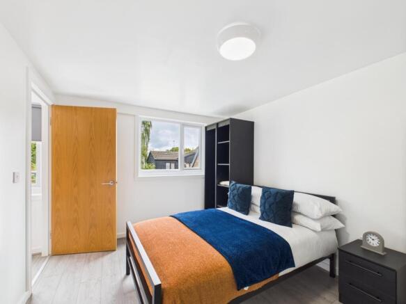 Bright, neatly presented bedroom with a double ...