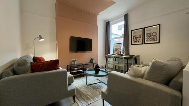 A spacious and stylish living room with modern ...