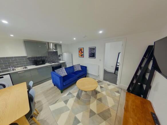 A spacious and inviting modern living room feat...