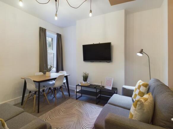 A bright and stylish large modern living room, ...