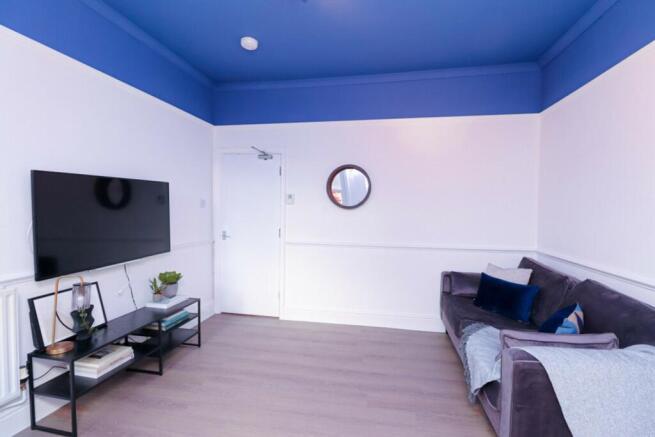 A stylish and spacious modern living room featu...