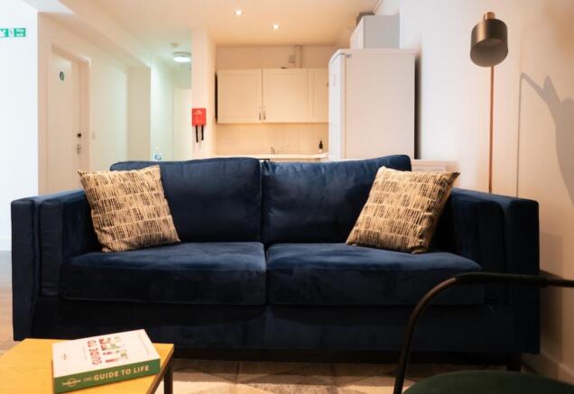 A cozy and inviting living room featuring a sty...