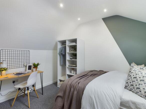 A stylish and inviting double bedroom with a co...