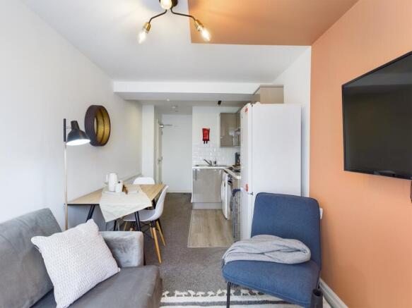 A bright and inviting large modern living room ...