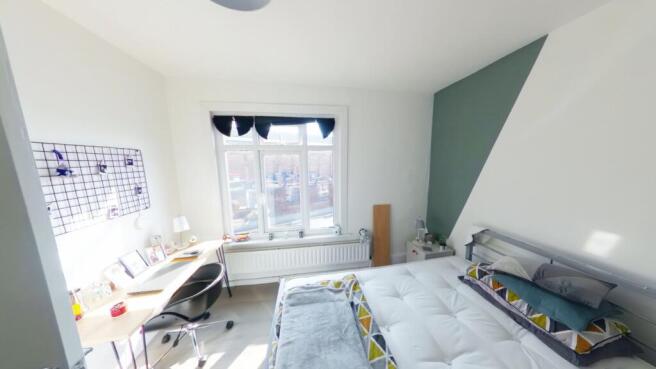 A spacious and bright large double bedroom with...
