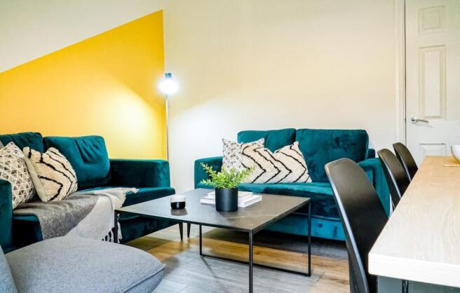 A bright and inviting large modern living room ...