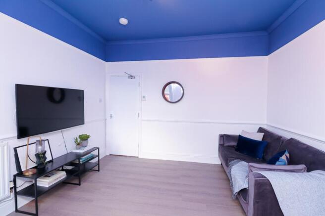 A stylish and spacious modern living room, perf...