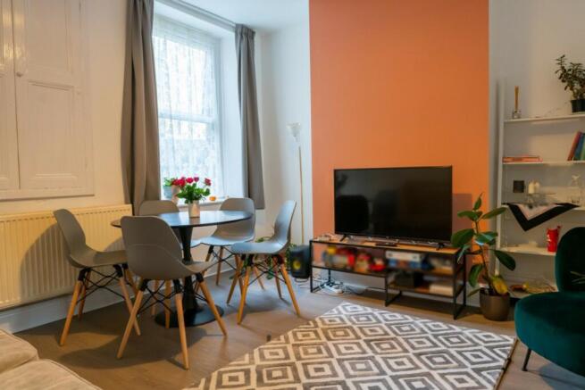 A bright and inviting large modern living room ...