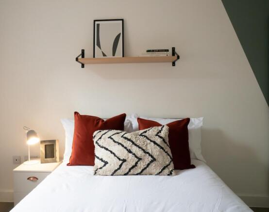 A stylish and inviting double bedroom featuring...