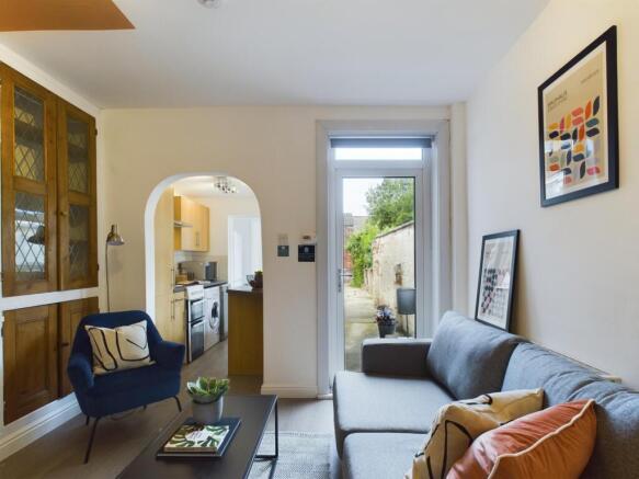 A spacious and inviting modern living room, fil...