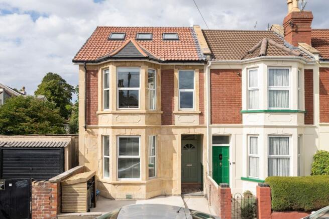 Attractive terraced house frontage with bay win...