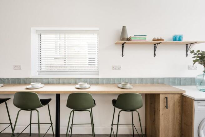 A modern kitchen with a clean design, featuring...