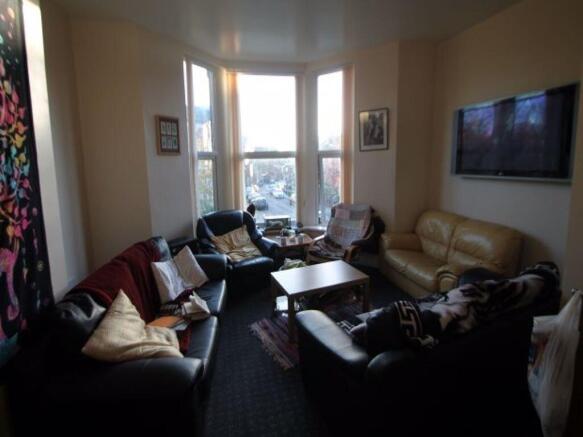 A cozy and inviting living room featuring a lar...