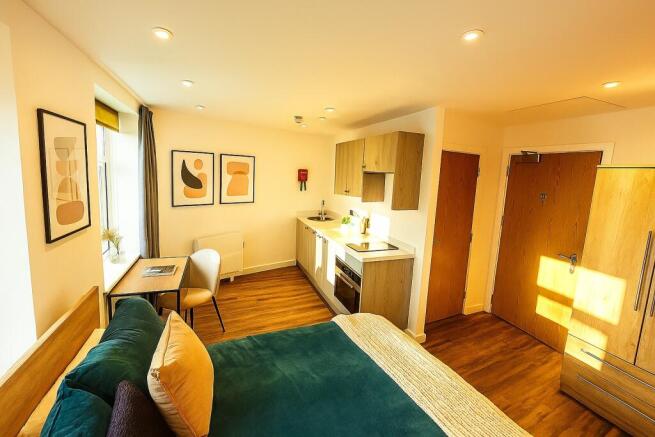 A bright and welcoming living room featuring la...