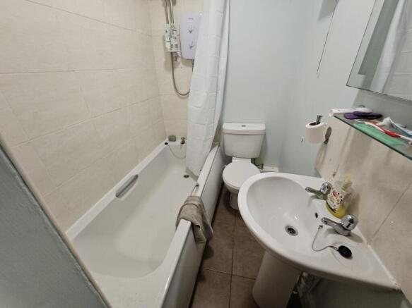 A clean and functional bathroom featuring a bat...