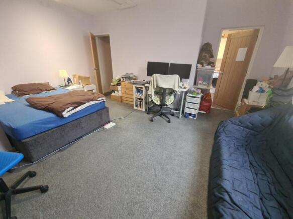 Spacious, well-appointed bedroom with a double ...